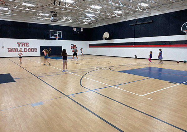 Photograph of kids playing in the schoolhouse gym